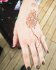 Kit "Pană de păun mână" tatuaje temporare cu henna și șabloane